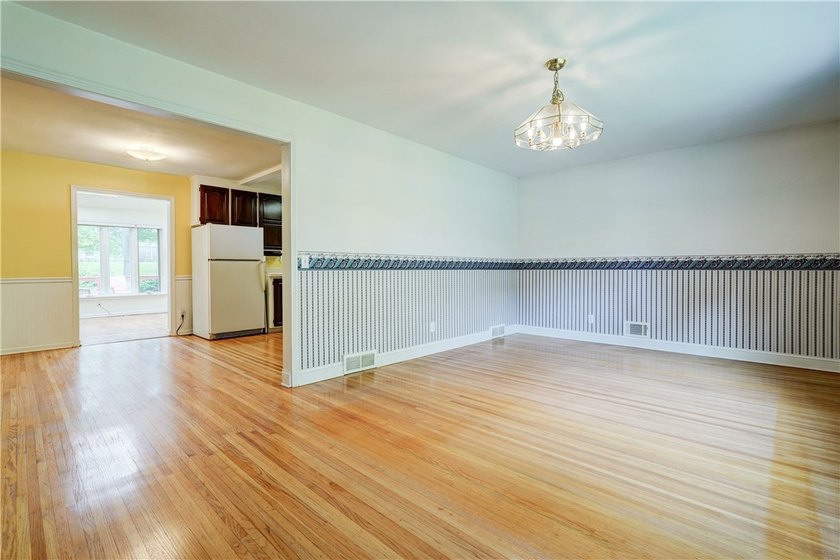 Conveniently located near Lake Ontario, this spacious 3-bedroom - photo 3