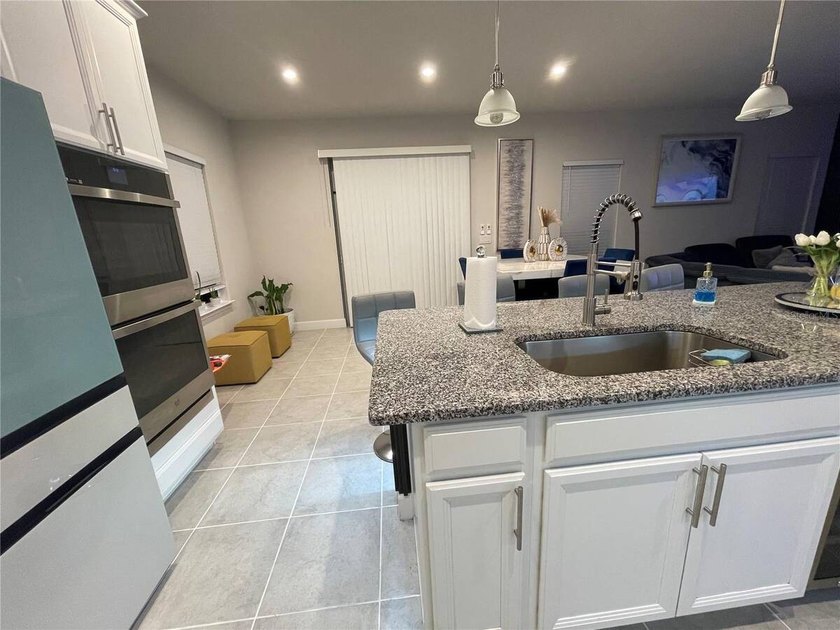 Built in 2023, this beautifully upgraded 5-bedroom, 3-bath home - photo 3