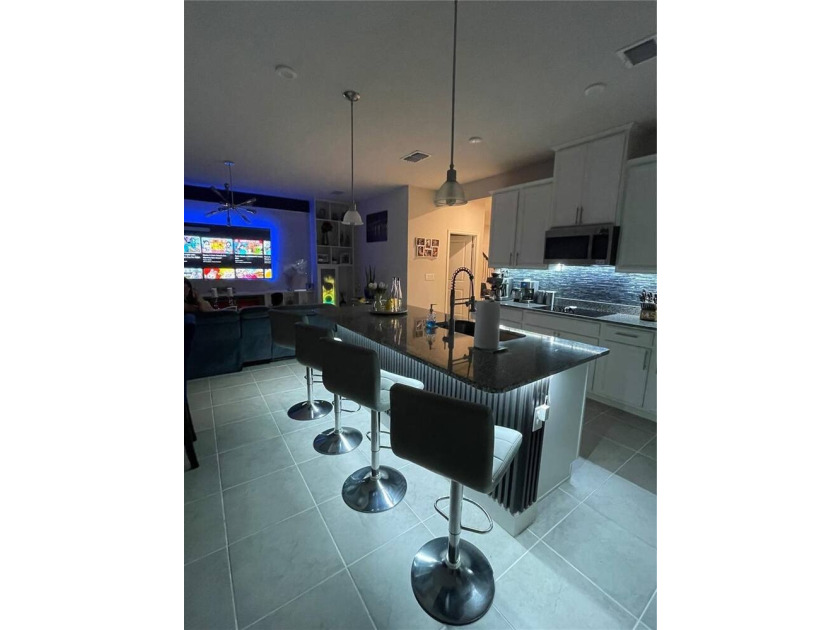 Built in 2023, this beautifully upgraded 5-bedroom, 3-bath home - photo 7