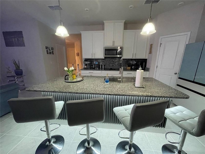 Built in 2023, this beautifully upgraded 5-bedroom, 3-bath home - photo 8