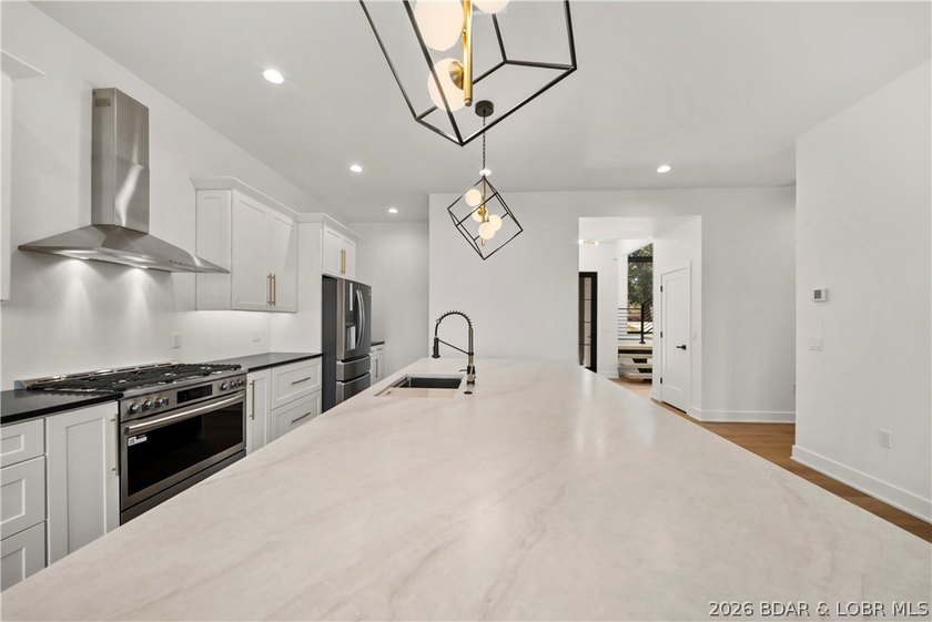 Introducing an exceptional new construction residence in the - photo 12