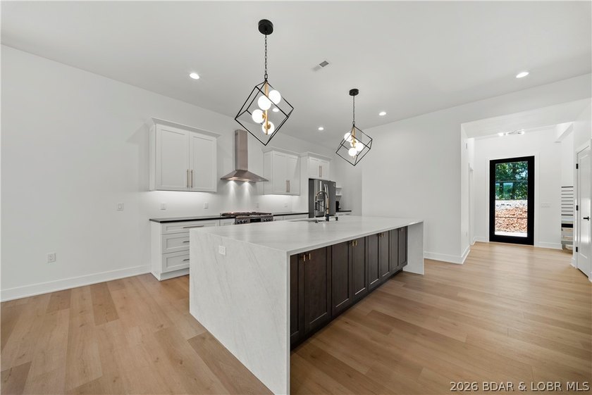 Introducing an exceptional new construction residence in the - photo 15