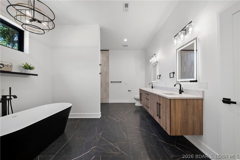 Introducing an exceptional new construction residence in the - photo 28