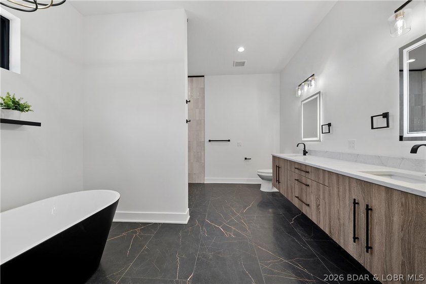 Introducing an exceptional new construction residence in the - photo 29
