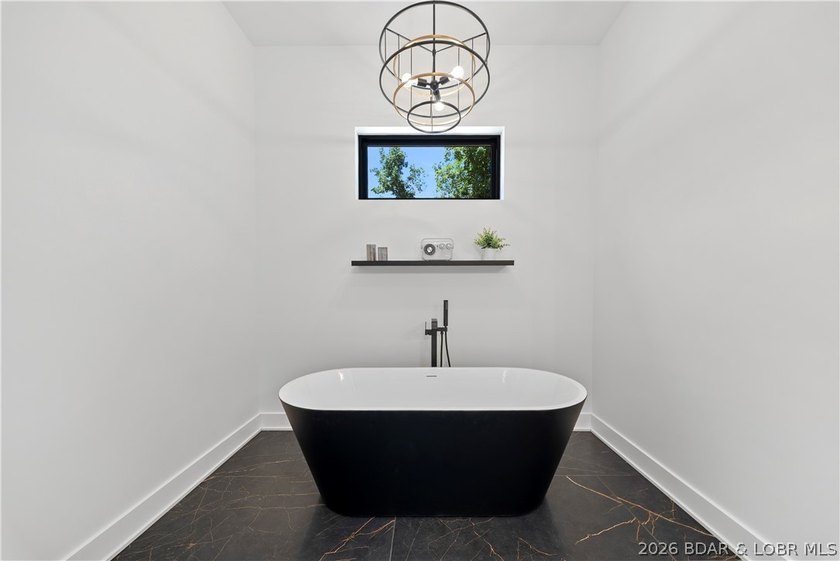 Introducing an exceptional new construction residence in the - photo 30