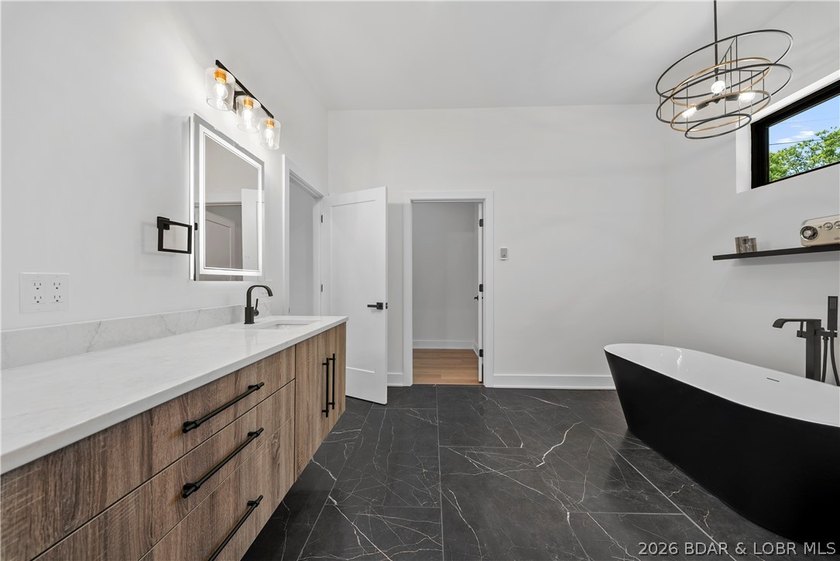 Introducing an exceptional new construction residence in the - photo 34