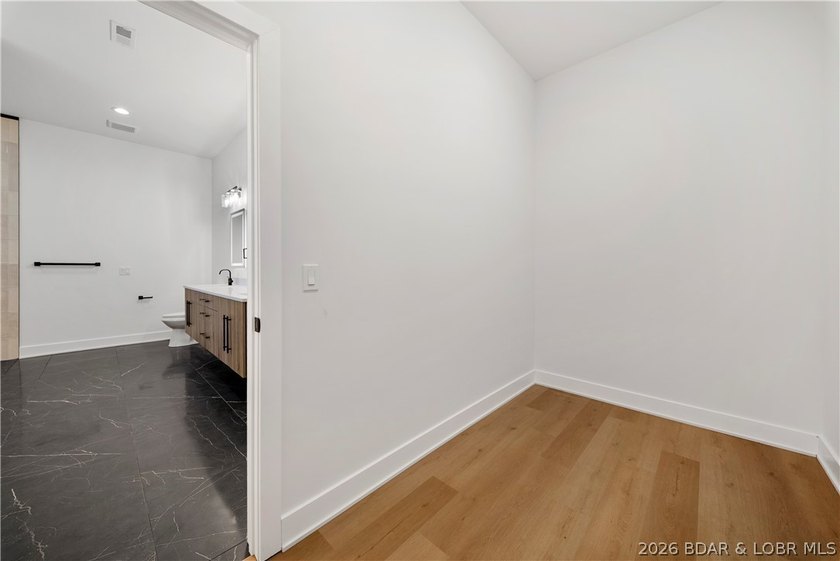 Introducing an exceptional new construction residence in the - photo 35
