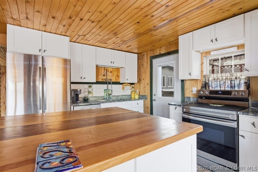 Charming lakefront cabin delivers the perfect blend of - photo 10