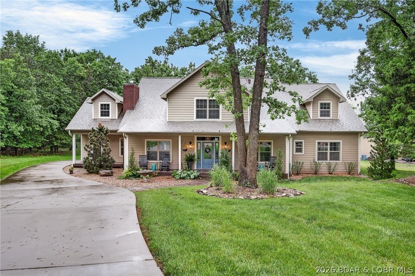Set on a beautifully landscaped, nearly one-acre lot in The - photo 3