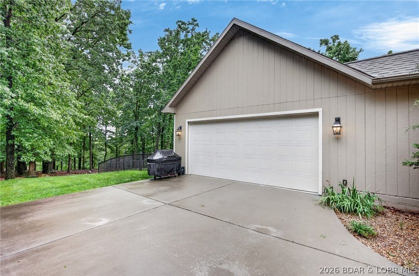 Set on a beautifully landscaped, nearly one-acre lot in The - photo 8