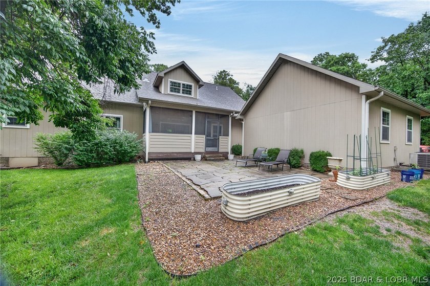 Set on a beautifully landscaped, nearly one-acre lot in The - photo 9