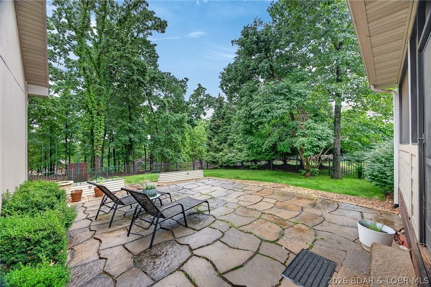 Set on a beautifully landscaped, nearly one-acre lot in The - photo 10