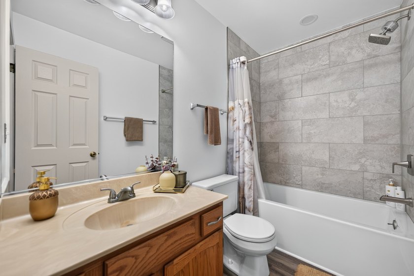 Welcome home to this beautifully maintained three-bedroom home - photo 31
