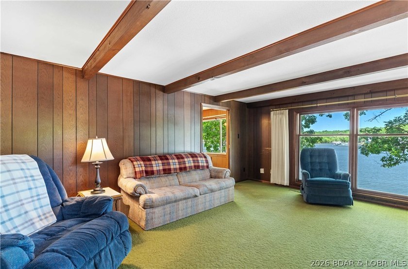 Tucked away on the sought-after Little Niangua Arm, this 3 bed - photo 2