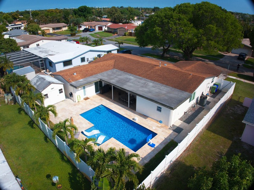 This beautifully maintained 4/2 pool home offers just under 2 - photo 11