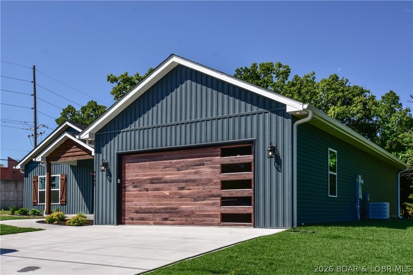 BRAND NEW HOME in the HEART of Osage Beach!! This striking home - photo 2