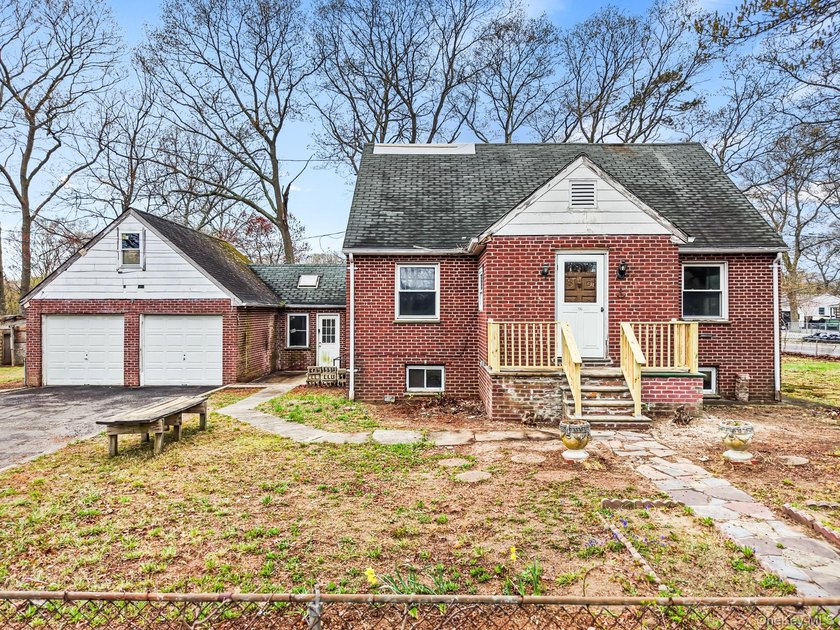 This spacious corner property nestled on a estimated half-acre - photo 3