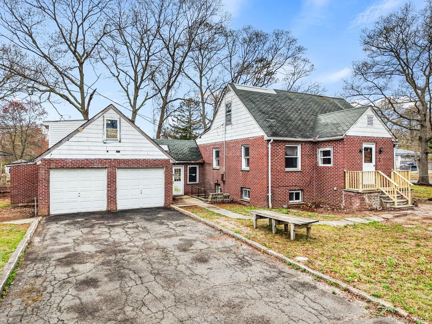 This spacious corner property nestled on a estimated half-acre - photo 4