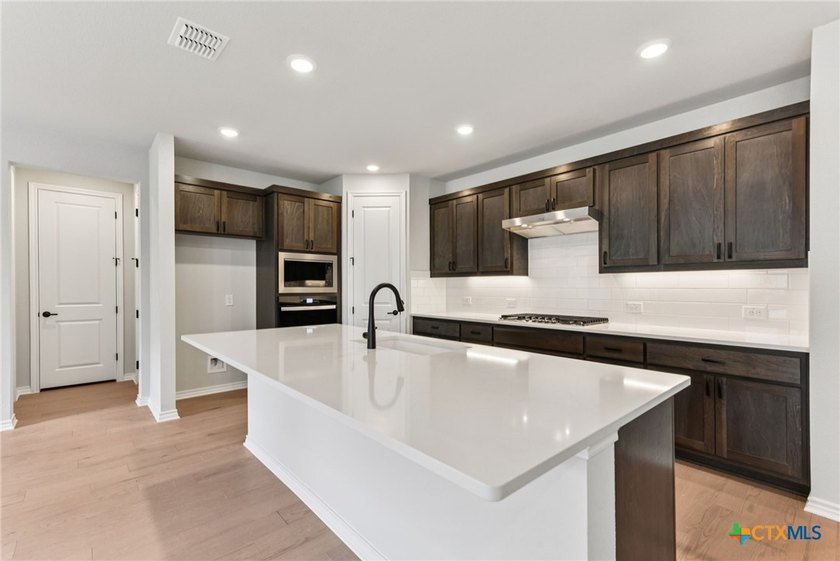 Trevino plan with upgraded kitchen, quartz countertops, upgraded - photo 11