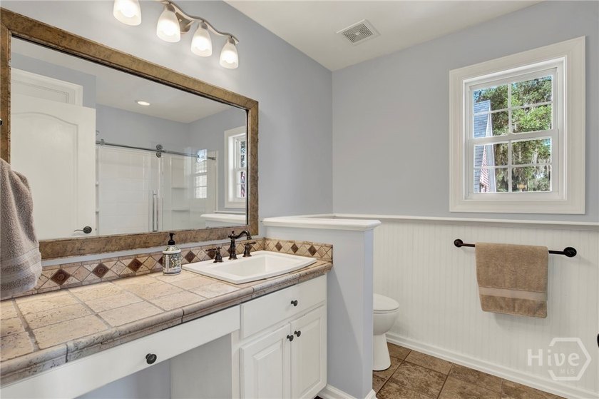 Nestled beneath majestic live oaks on a picturesque 1.9-acre - photo 29