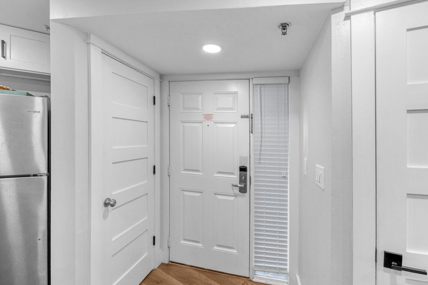 This beautifully appointed 2-bedroom, 2-bath condo is move-in or - photo 3