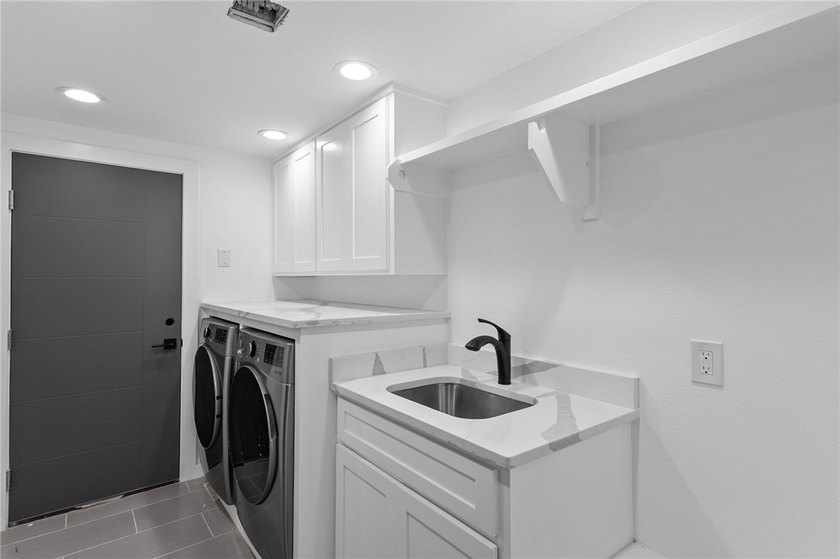Welcome to luxury coastal living on iconic Ocean Drive, offering - photo 18