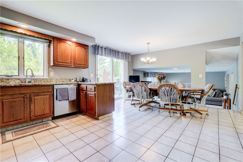 Welcome to this well-maintained split level home in Gates. Lots - photo 6