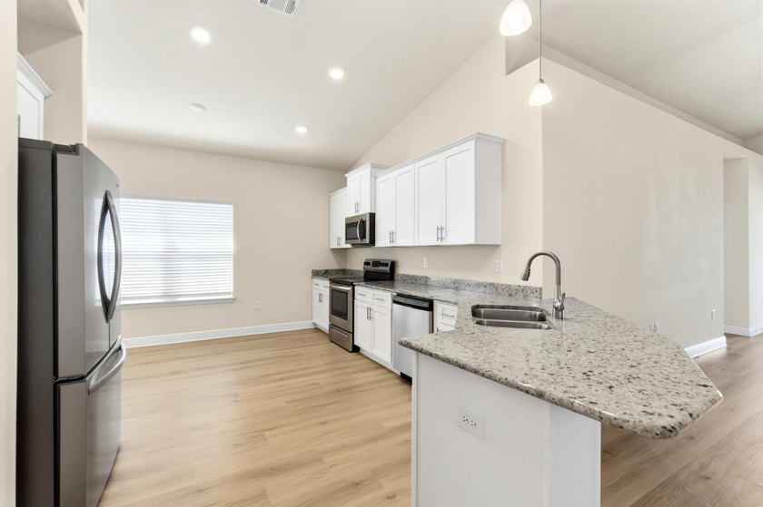 Why wait for new construction? This 2022-built home delivers the - photo 8