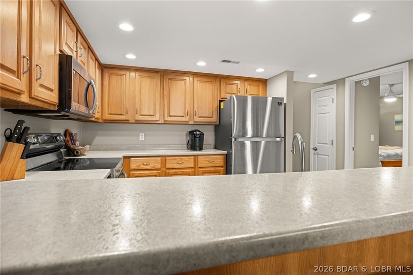 Experience the ultimate Lake of the Ozarks lifestyle in this - photo 9