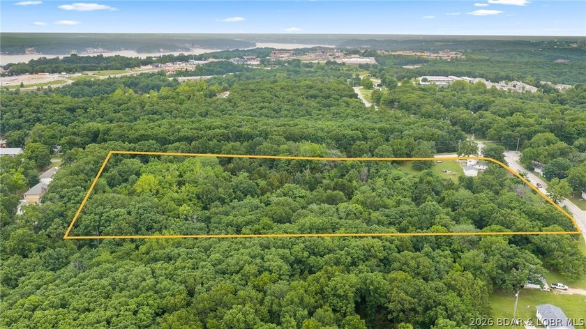 7.8 +/- wooded acres in the heart of Osage Beach with city sewer - photo 2