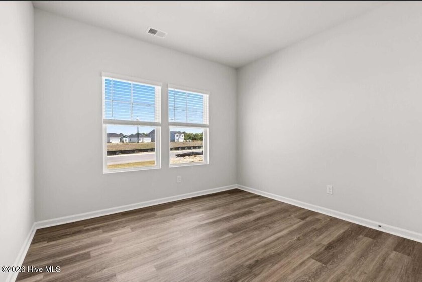 Discover the Burton, a spacious and stylish one-story home with - photo 3