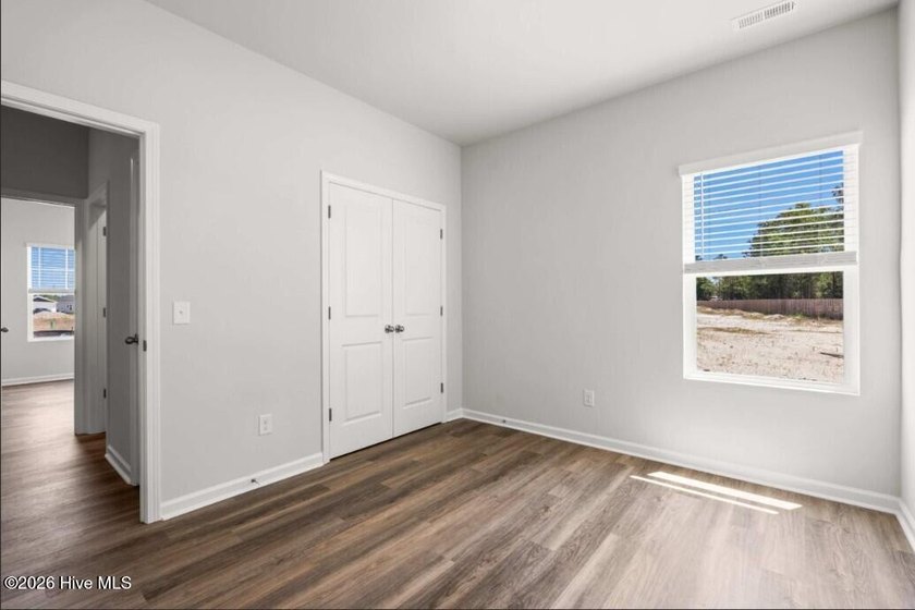 Discover the Burton, a spacious and stylish one-story home with - photo 5