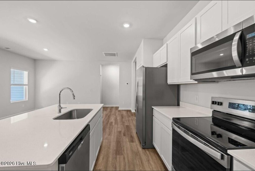 Discover the Burton, a spacious and stylish one-story home with - photo 8