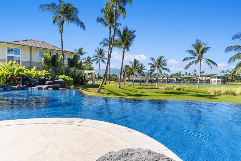 This 2-bedroom, 2-bath condo is located on the second floor and - photo 2