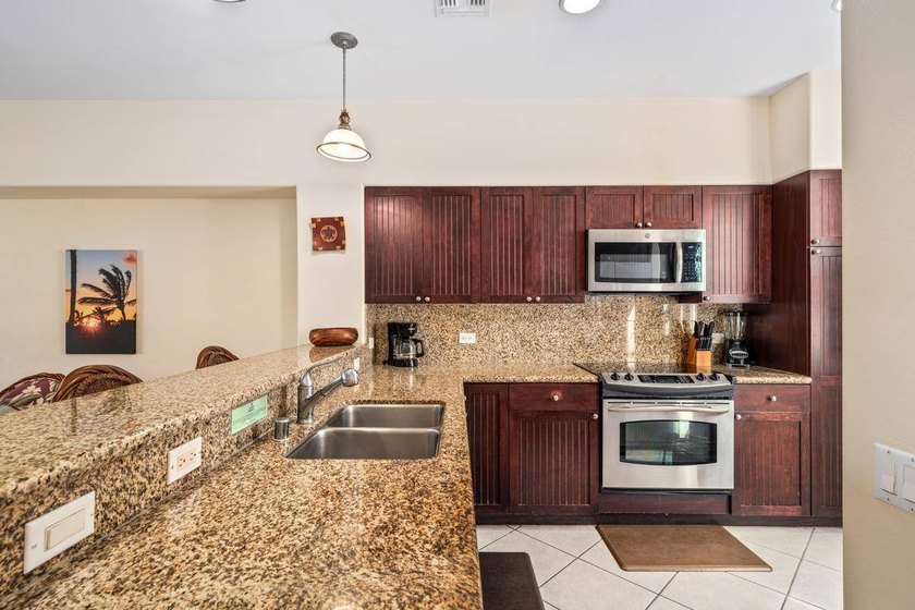 This 2-bedroom, 2-bath condo is located on the second floor and - photo 4
