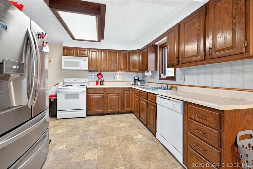 Tucked away on 2.33 lakefront acres, 33400 Kings Way Road offers - photo 2