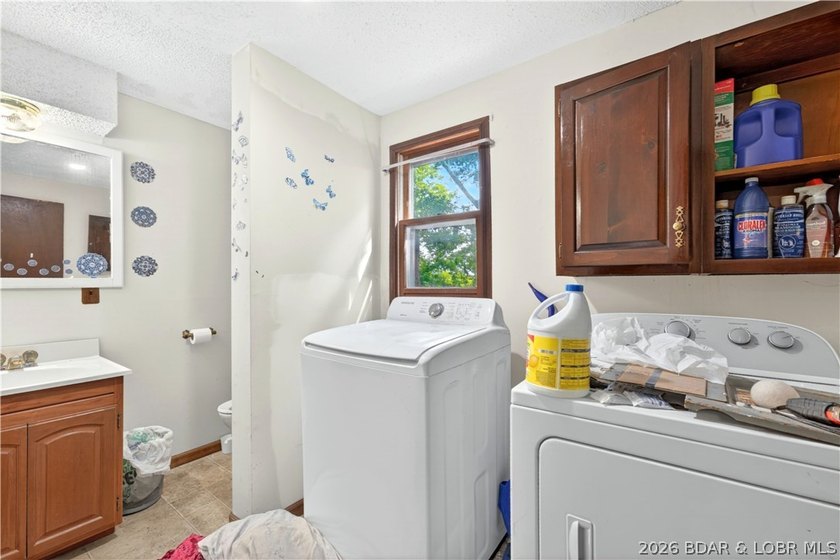 Tucked away on 2.33 lakefront acres, 33400 Kings Way Road offers - photo 4