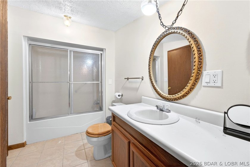 Tucked away on 2.33 lakefront acres, 33400 Kings Way Road offers - photo 8