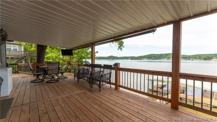 Located at the 43 MM, this lakefront property offers 75' of - photo 2