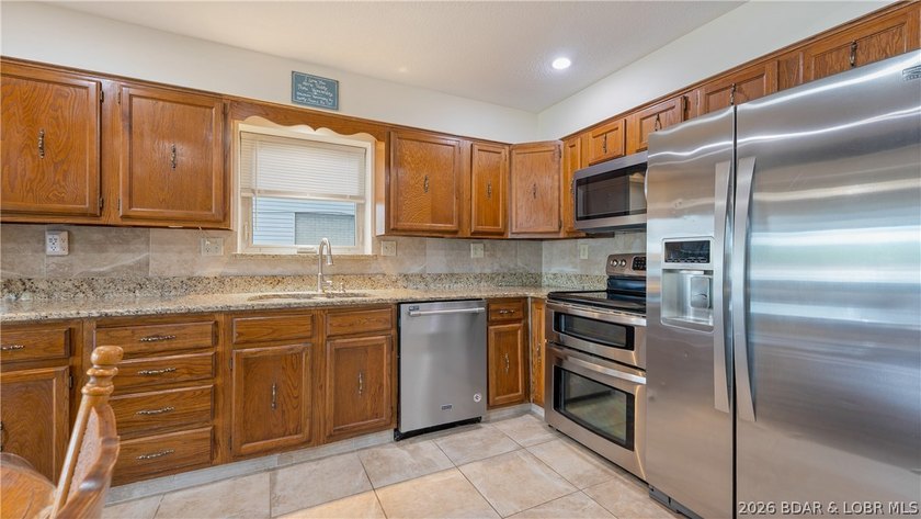 Located at the 43 MM, this lakefront property offers 75' of - photo 8