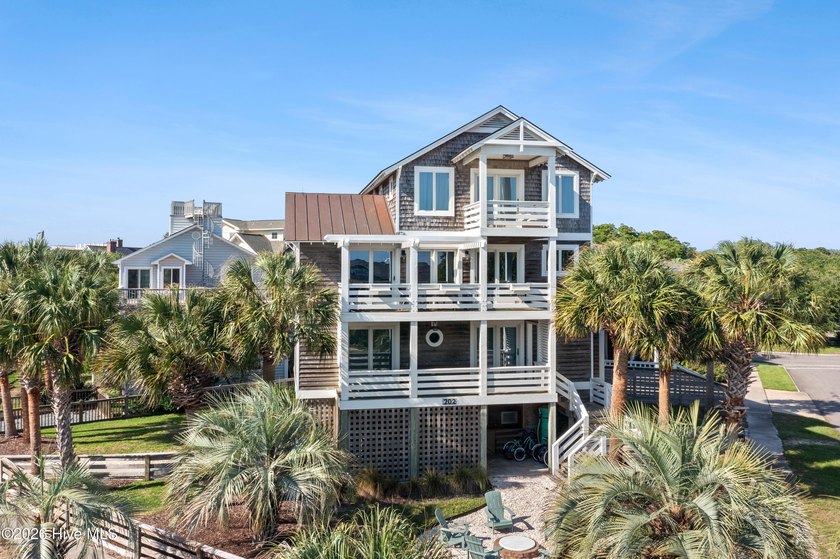 Set on one of Wrightsville Beach's most coveted streets in the - photo 2