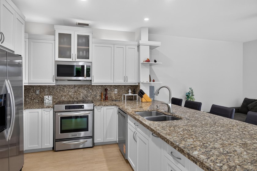 Welcome to this stunning waterfront residence nestled in The - photo 11