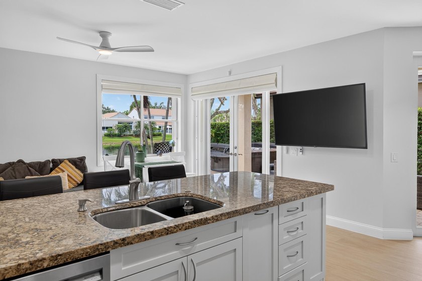 Welcome to this stunning waterfront residence nestled in The - photo 14