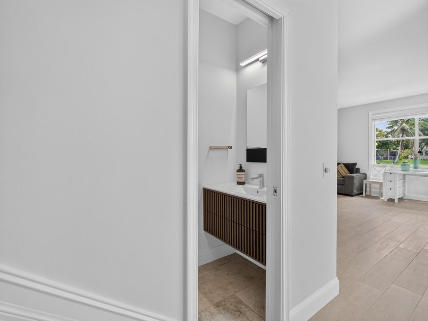 Welcome to this stunning waterfront residence nestled in The - photo 18