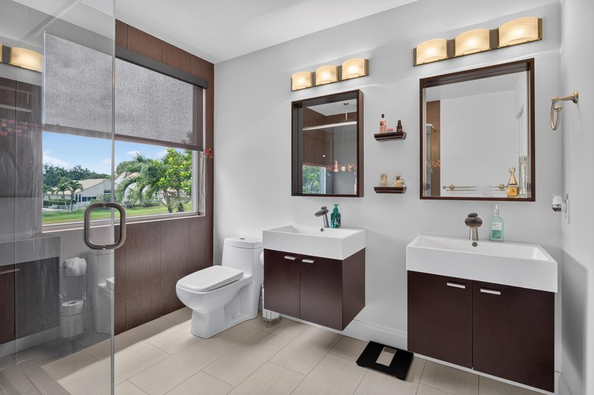 Welcome to this stunning waterfront residence nestled in The - photo 25