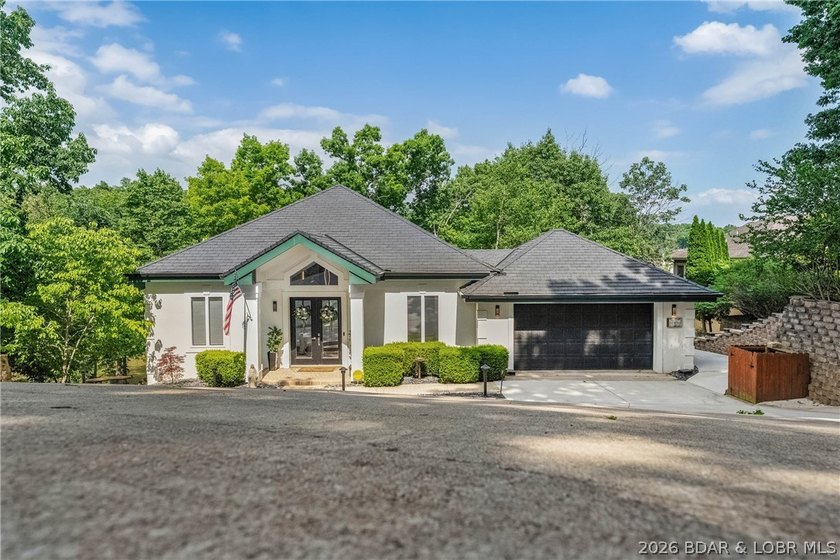 Tucked away in the prestigious Villages at Shawnee Bend, this - photo 5