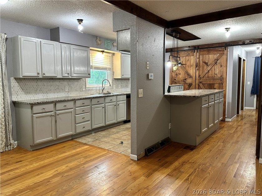 4-bed, 2-bath home in Warsaw featuring an open floor plan - photo 9