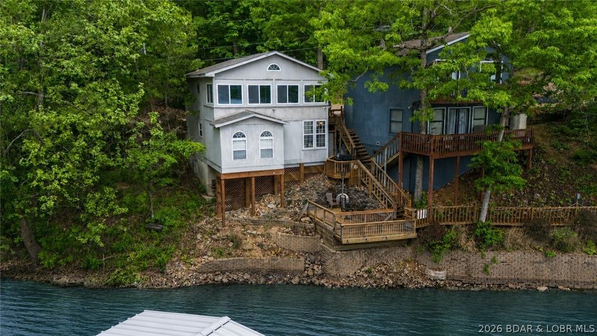Discover peaceful lakefront living in this charming home tucked - photo 2
