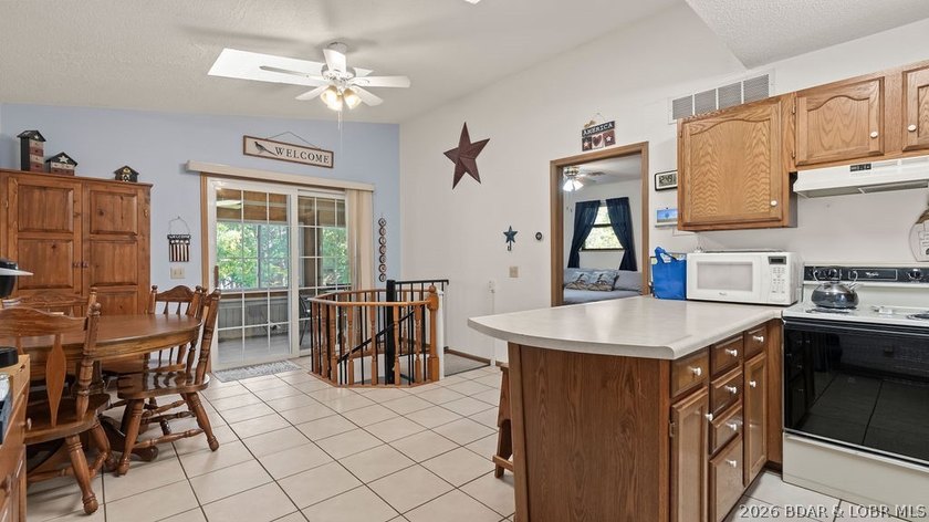 Discover peaceful lakefront living in this charming home tucked - photo 4