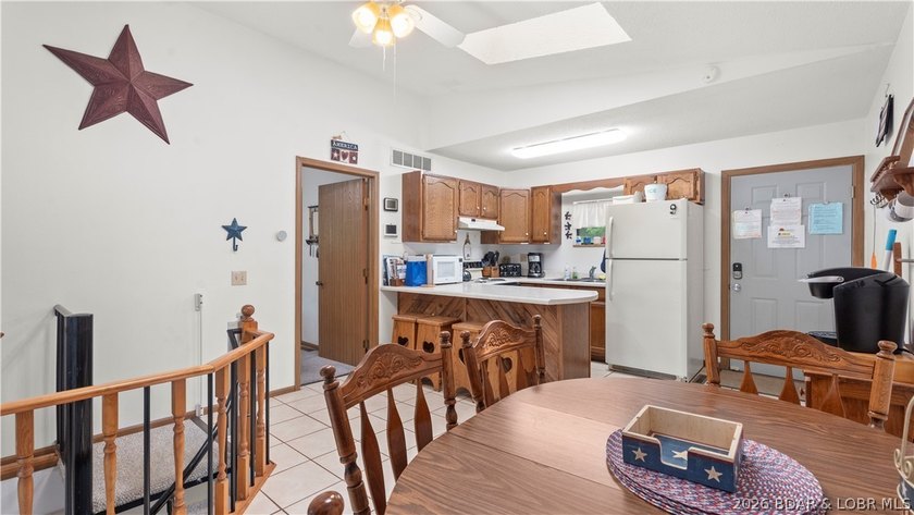 Discover peaceful lakefront living in this charming home tucked - photo 10